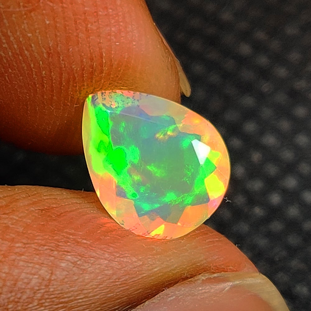 1.23 Ct Natural Multicolor Welo Opal Flash Fire Pear Cut: Weight - 1.23 Ct / Dimensions - 10.00 x 7.90 x 4.30 mm / Shape & Cut - Pear Cut / Color - Multicolor / Transparency - Translucent / Origin - Ethiopia / Comments - None