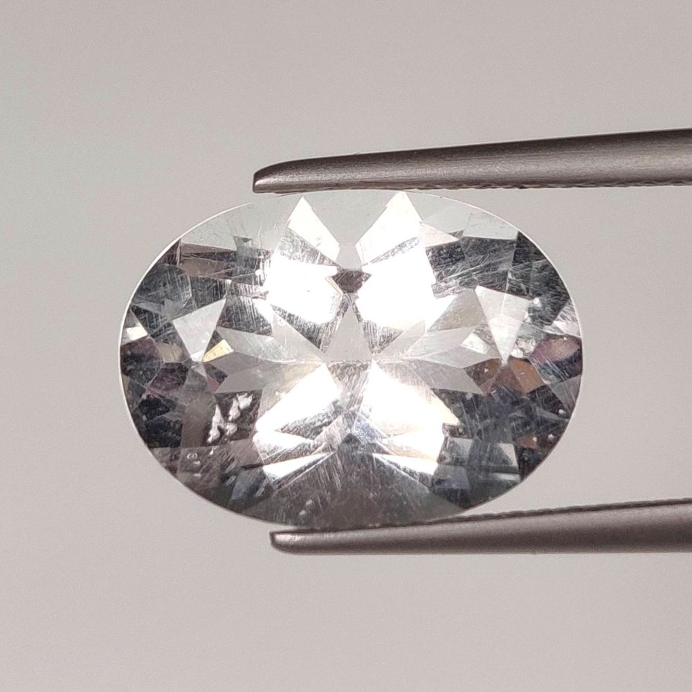 5.67 Ct Natural Colorless Pollusite Oval Cut (1 of 2)