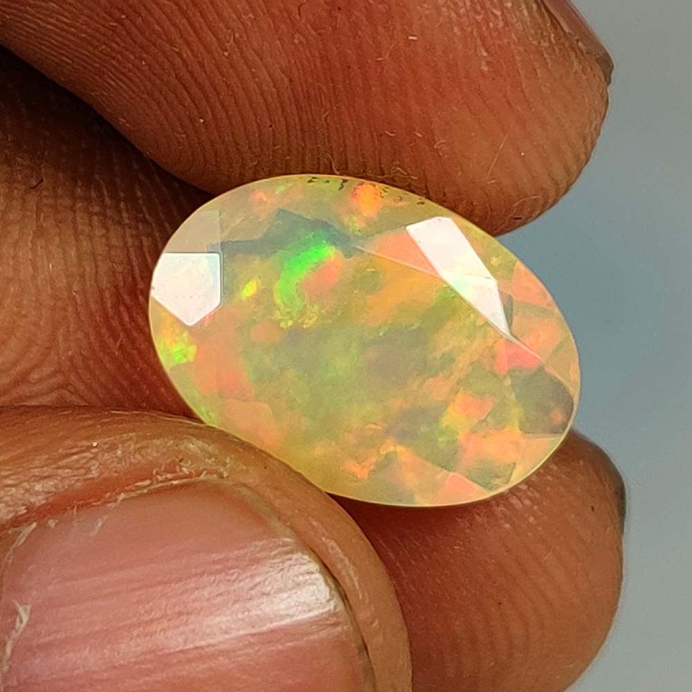 2.69 Ct Natural Multicolor Welo Opal Flash Fire Oval Cut: Weight - 2.69 Ct / Dimensions - 13.80 x 9.80 x 5.40 mm / Shape - Oval Cut / Color - Multicolor / Clarity - Translucent / Origin - Ethiopia / Treatment - None