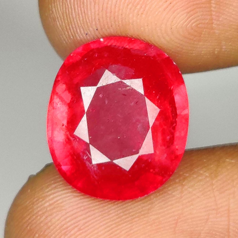 9.70 Ct Natural Pinkish Red Ruby Oval Cut: Weight : 9.70 Ct / Dimensions - 13.40 x 11.60 x 6.40 mm / Shape : Oval Cut / Color : Pinkish Red / Transparency : Transparent / Treatment : Standard Heated