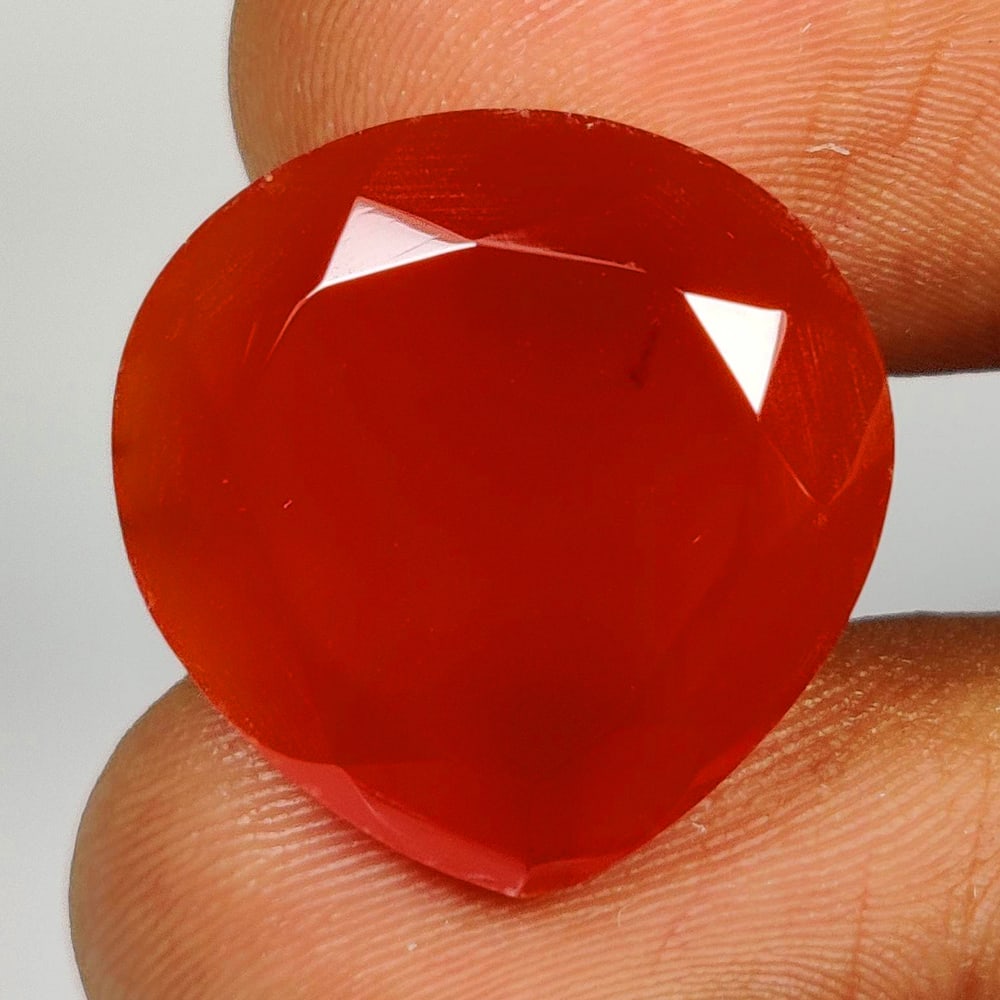 14.19 Ct Natural Orange Onyx Pear Cut: Weight - 14.19 Ct / Size - 18.10 x 7.90 x 8.00 mm / Shape - Pear Cut / Clarity - Opaque / Origin - Brazil / Treatment - None