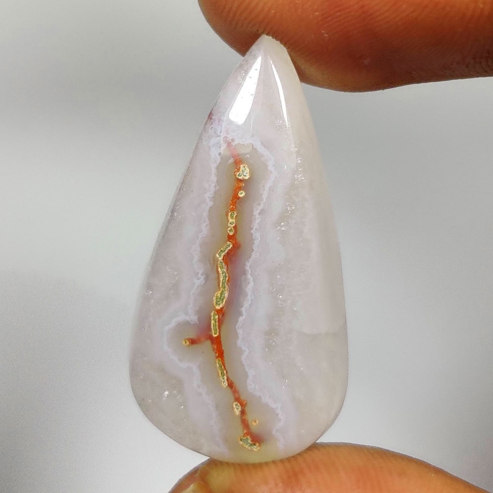 21.75 Ct Natural Solar Coral Pear Cab: weight - 21.75 Ct / Size - 33.00 x 16.00 x 5.90 mm / Shape - Excellent Pear Cab / Origin - Brazil / Treatment - None