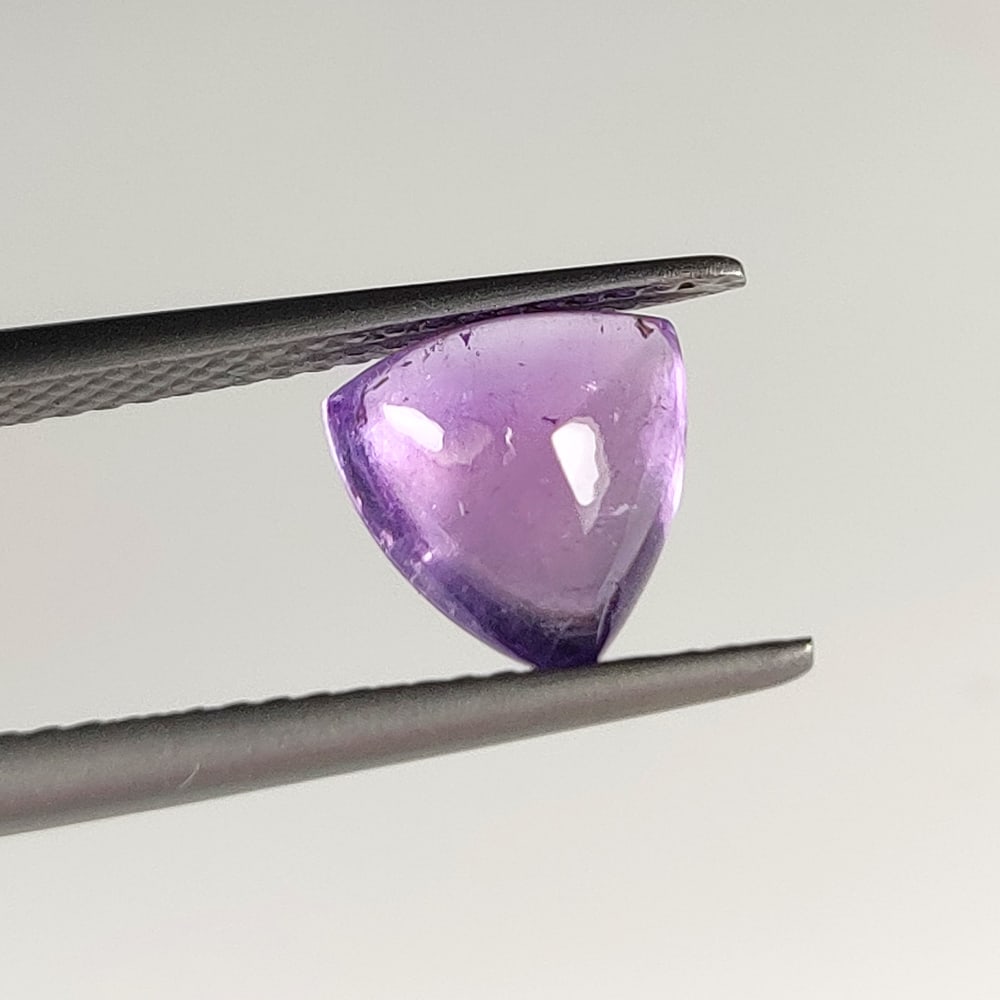 1.79 Ct Natural Purple Amethyst Trillion Cab: Weight - 1.79 Ct / Dimensions - 7.90 x 7.90 x 5.00 mm / Shape - Trillion Cab / Color - Purple / Clarity - VVS / Origin -Brazil / Treatment - Heated