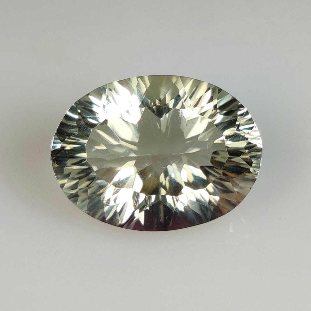 15.77 Ct Natural Green Amethyst Oval Cut: Weight - 15.77 Ct / Size - 19.60 x 14.60 x 9.70 mm / Shape - Oval Cut / Color - Green / Clarity - VVS / Origin - Brazil / Treatment - Heated