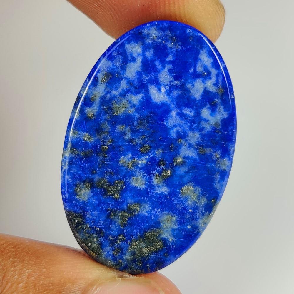 43.16 Ct Natural Blue Lapis Lazuli Oval Cab: Weight - 43.16 Ct / Size - 32.00 x 20.10 x 7.00 mm / Shape - OVal Cab / Clarity - Opaque / Origin - Afghanisthan / Treatment - None