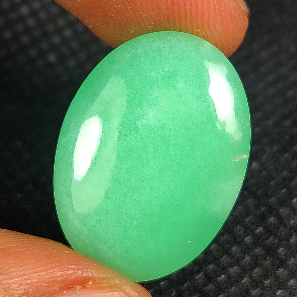 20.86 Ct Natural Chrysoprase Oval Cab: Weight - 20.86 Ct / Size - 23.50 x 17.50 x 7.60 mm / Shape - Oval Cab / Color - Green / Clarity - Opaque / Origin - Brazil / Treatment - Heated