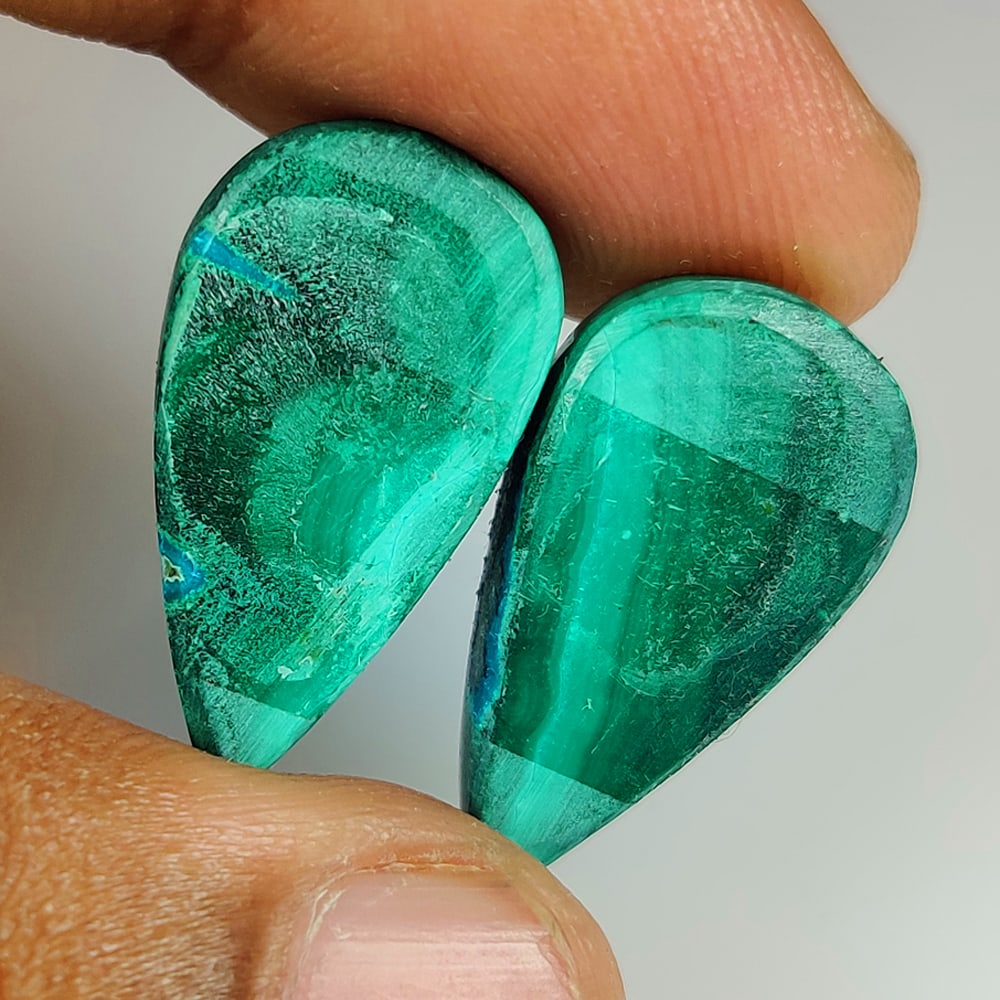 33.76 Ct Natural Green Malachite Pear Cab Pair: Weight - 33.76 Ct / Dimensions - 22.90 x 12.60 x 5.10 mm / 2 Pc's / Shape - Pear Cab / Color - Green / Clarity - Opaque / Origin - Russia / Treatment - None