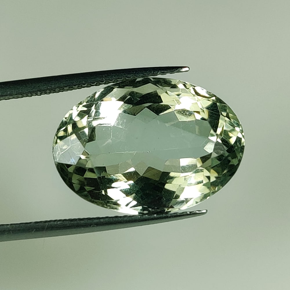 13.51 Ct Natural Green Amethyst Oval Cut: Weight - 13.51 Ct / Size - 18.10 x 13.00 x 9.60 mm / Shape - Oval Cut / Color - Green / Clarity - VVS / Origin - Brazil / Treatment - Heated