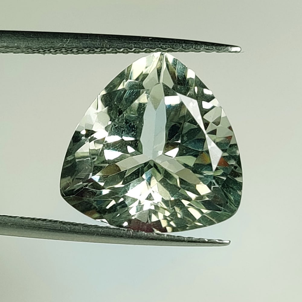 9.04 Ct Natural Green Amethyst Trillion Cut: Weight - 9.04 Ct / Size - 14.10 x 14.00 x 9.50 mm / Shape - Trillion Cut / Color - Green / Clarity - VVS / Origin - Brazil / Treatment - Heated