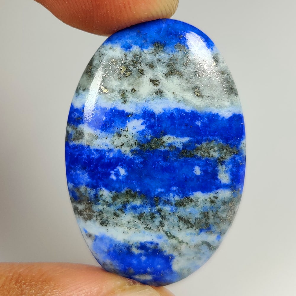 37.43 Ct Natural Blue Lapis Lazuli Oval Cab: Weight - 37.43 Ct / Size - 36.00 x 22.60 x 5.20 mm / Shape - OVal Cab / Clarity - Opaque / Origin - Afghanisthan / Treatment - None