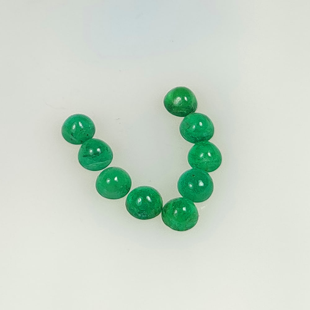 2.10 Ct Natural Zambian Green Emerald Round Cab Set: Weight - 2.10 Ct / Dimensions - 3.80 - 4.00 mm / 9 Pc's / Shape - Round Cab / Color - Green / Clarity - SI/ Origin - Zambia / Treatment - Natural Emeralds are commonly enhanced by oil