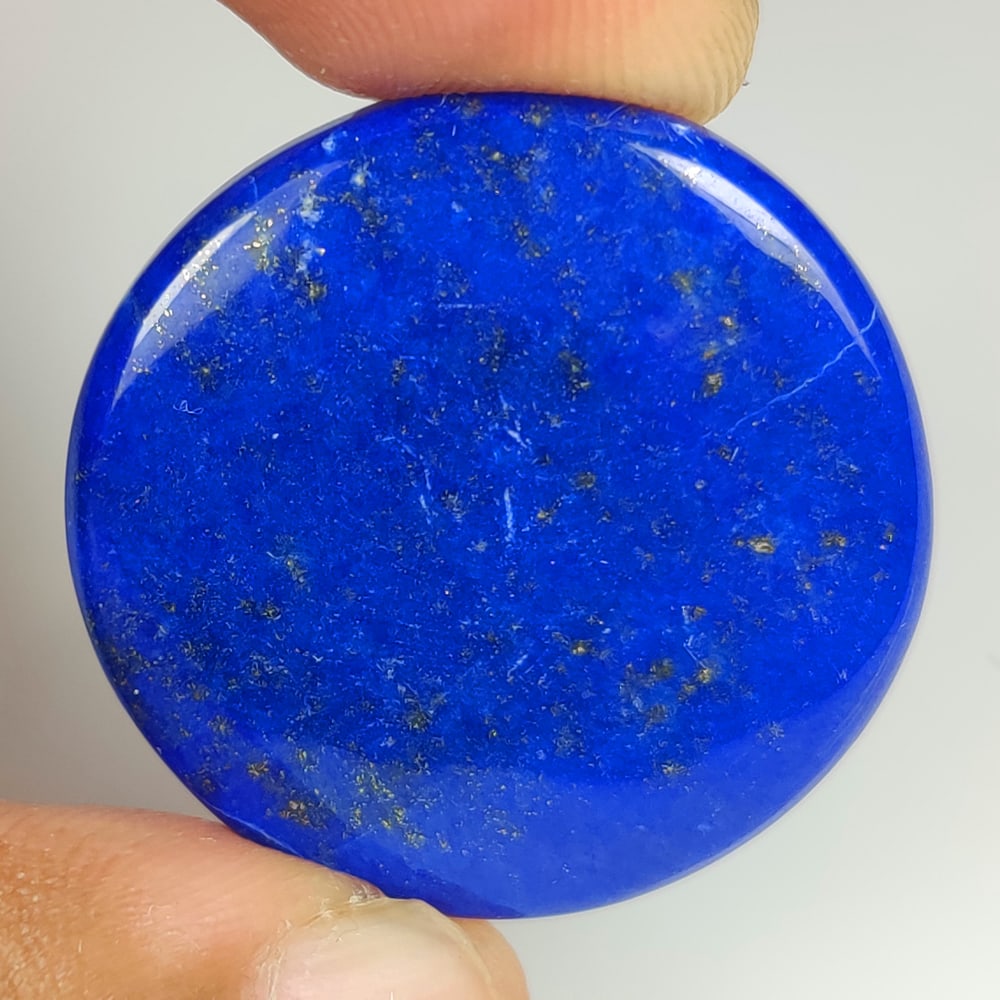 44.34 Ct Natural Blue Lapis Lazuli Round Cab: Weight - 44.34 Ct / Size - 31.00 x 31.00 x 5.10 mm / Shape - Round Cab / Clarity - Opaque / Origin - Afghanisthan / Treatment - None