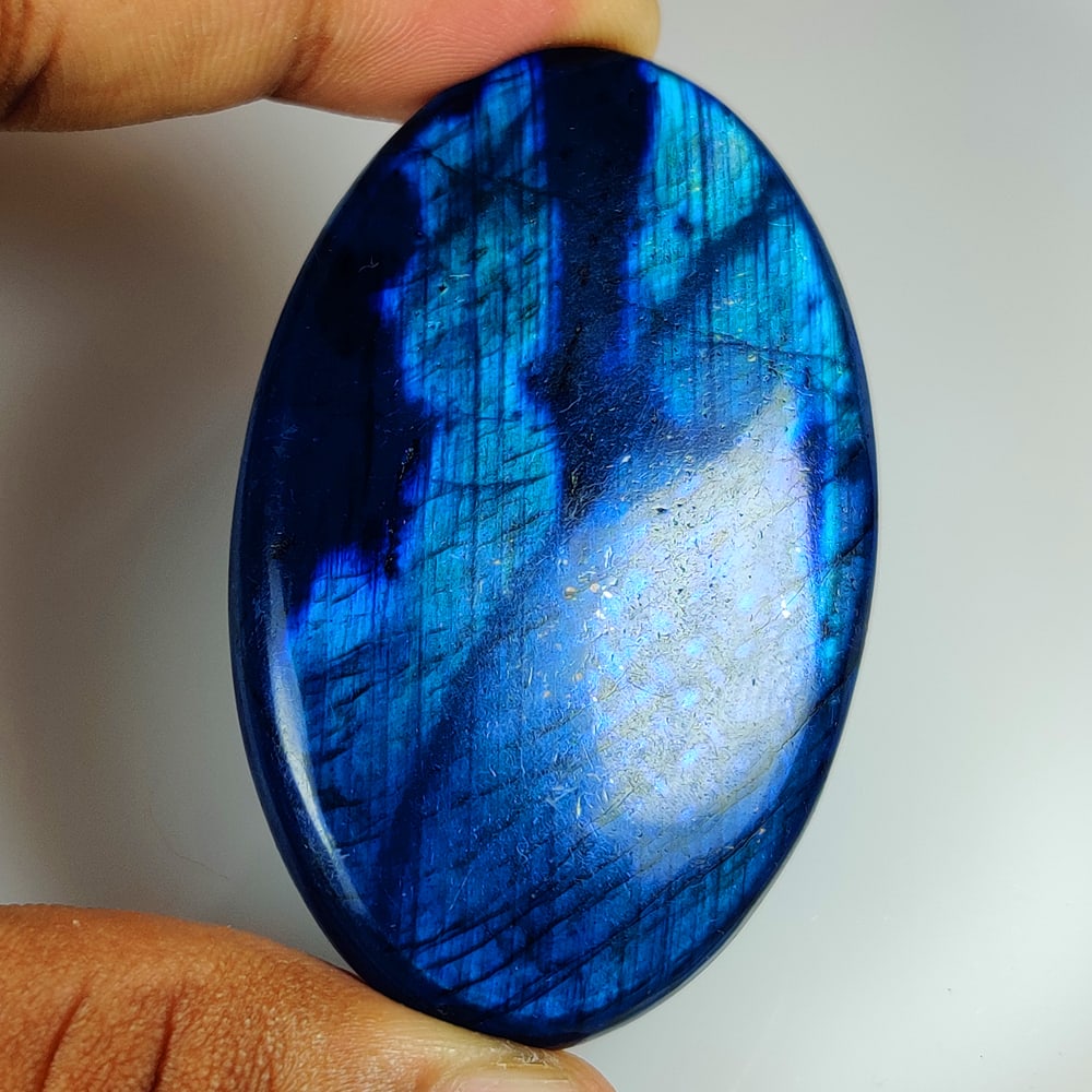 132.25 Ct Natural Blue Shaded Labradorite JUMBO Oval Cab: Weight - 132.25 Ct / Size - 62.00 x 39.00 x 6.60 mm / Shape - Excellent OVal Cab / Clarity - Opaque / Origin - Africa / Treatment - None