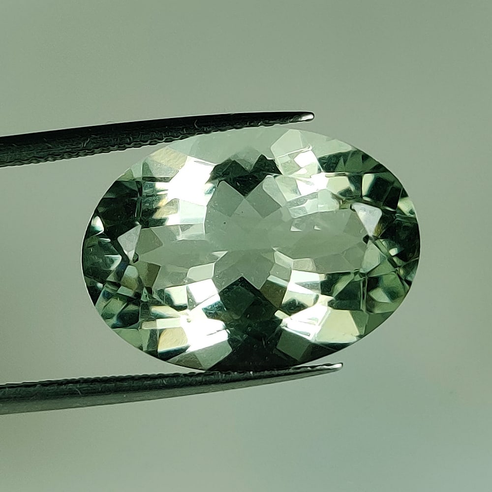 10.45 Ct Natural Green Amethyst Oval Cut: Weight - 10.45 Ct / Size - 18.20 x 13.10 x 8.20 mm / Shape - Oval Cut / Color - Green / Clarity - VVS / Origin - Brazil / Treatment - Heated