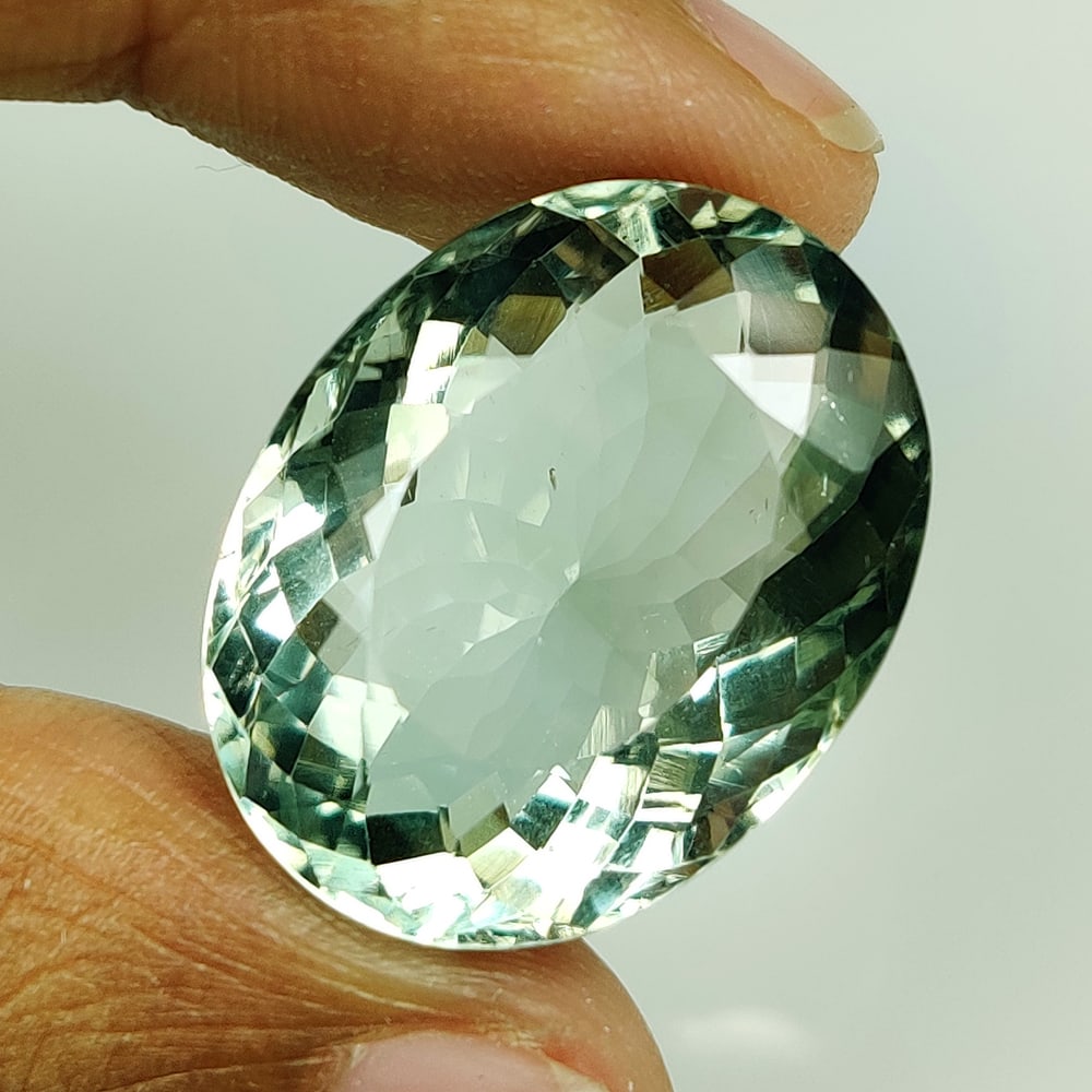 23.07 Ct Natural Green Amethyst Oval Cut: Weight - 23.07 Ct / Size - 21.50 x 16.80 x 10.90 mm / Shape - Oval Cut / Color - Green / Clarity - VVS / Origin - Brazil / Treatment - Heated