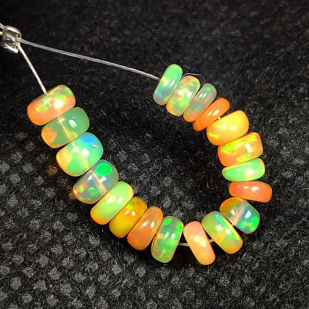 5.08 Ct Natural Multicolor Welo Opal Flash Fire Round Beads: Weight - 5.08 Ct / Dimensions - 4.50 - 4.80 mm / 19 Pc's / Shape & Cut - Drilled Round Beads / Color - Multicolor / Transparency - Translucent / Origin - Ethiopia / Comments - None