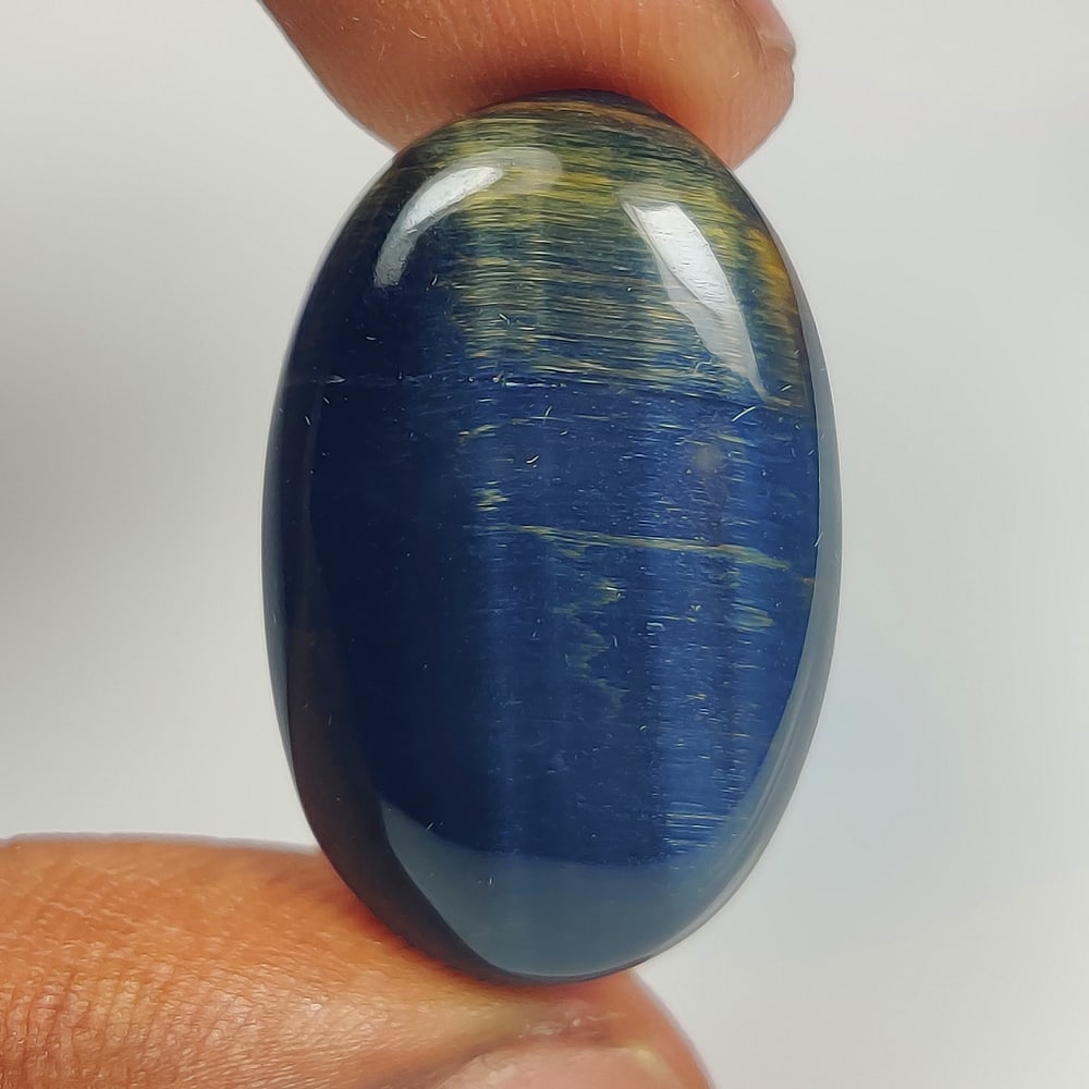 25.00 Ct Natural Black Tiger Eye Oval Cab: Weight - 25.00 Ct / Dimensions -28.00 x 17.60 x 6.00 mm / Top Class Quality / Oval Cab / Origin - Burmese / Comments - None