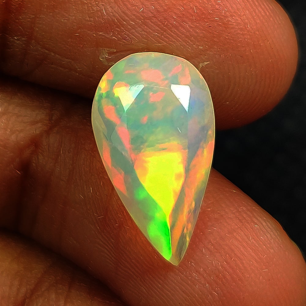 2.22 Ct Natural Multicolor Welo Opal Flash Fire Pear Cut: Weight - 2.22 Ct / Dimensions - 13.70 x 8.00 x 5.00 mm / Shape & Cut - Pear Cut / Color - Multicolor / Transparency - Translucent / Origin - Ethiopia / Comments - None