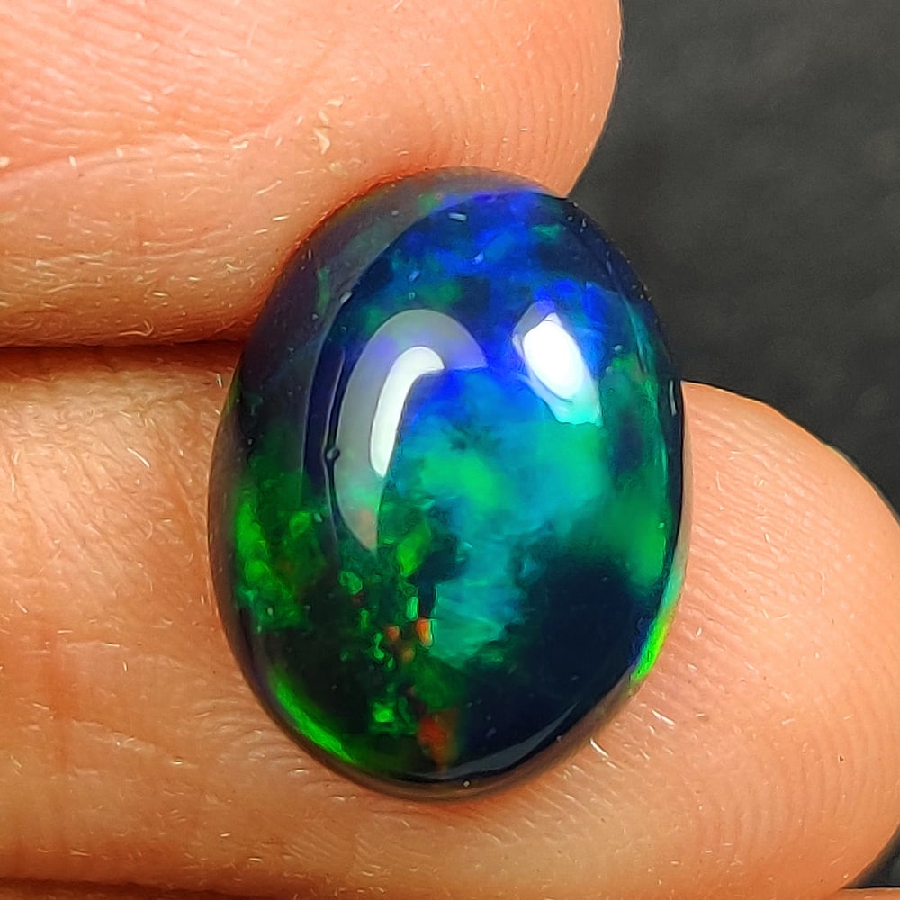 2.38 Ct Natural Black Flashing Fire Opal Oval Cab (1 of 3)