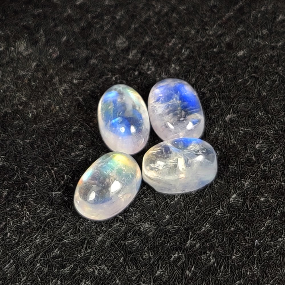 2.76 Ct Natural Blue Tint Moonstone Oval Cab Set: Weight - 2.76 Ct / Dimensions - 6.1x4.2 - 6.4x4.5 mm / 4 Pc's / Shape - Oval Cab / Clarity -Transparent / Origin - India / Treatment - None