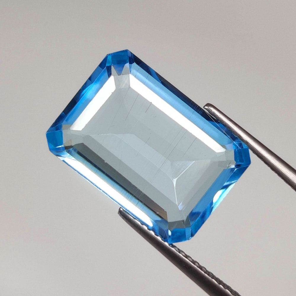 12.03 Ct Natural Blue Topaz Octagon Cut: Weight - 12.03 Ct / Dimensions - 17.00 x 12.00 x 5.50 mm / Shape - Octagon Cut / Color - Blue / Clarity - VVS / Origin - Brazil / Treatment - Irradiated