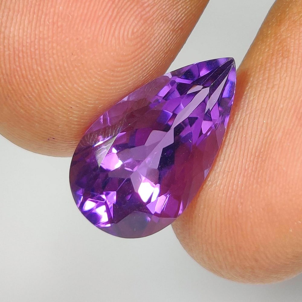 6.48 Ct Natural Purple Amethyst Pear Cut: Weight - 6.48 Ct / Dimensions - 17.10 x 9.80 x 7.70 mm / Shape - Pear Cut / Color - Purple / Clarity - VVS / Origin -Brazil / Treatment - Heated