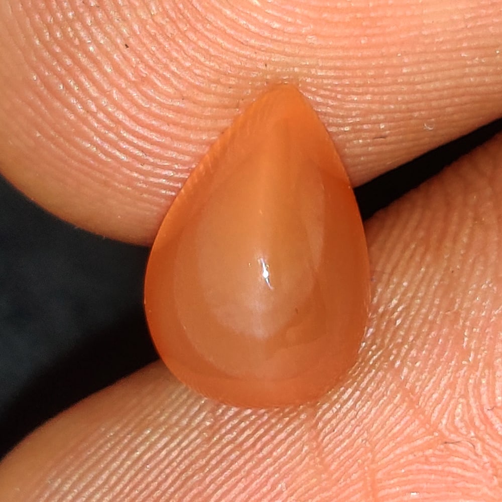 2.00 Ct Natural Orange Moonstone Pear Cab: Weight - 2.00 Ct / Dimensions - 10.20 x 7.00 x 4.80 mm / Shape - Pear Cabochon / Clarity - Semi-Transparent / Origin - India / Treatment - None