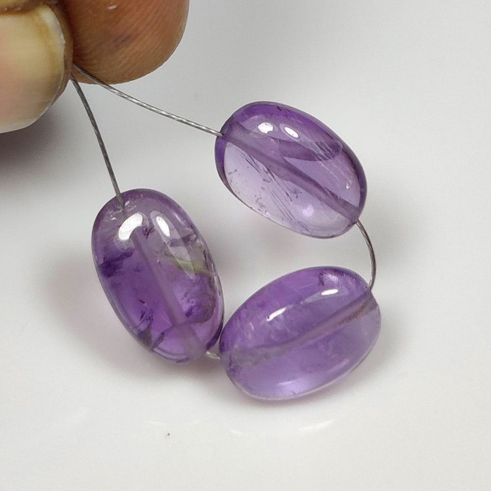 10.22 Ct Natural Purple Amethyst OVal Beads: Weight - 10.22 Ct / Dimensions -10.8x7.5 - 11.1x8.3 mm / 3 Pc's / Shape - Oval Beads / Color - Purple / Clarity - VVS / Origin -Brazil / Treatment - Heated
