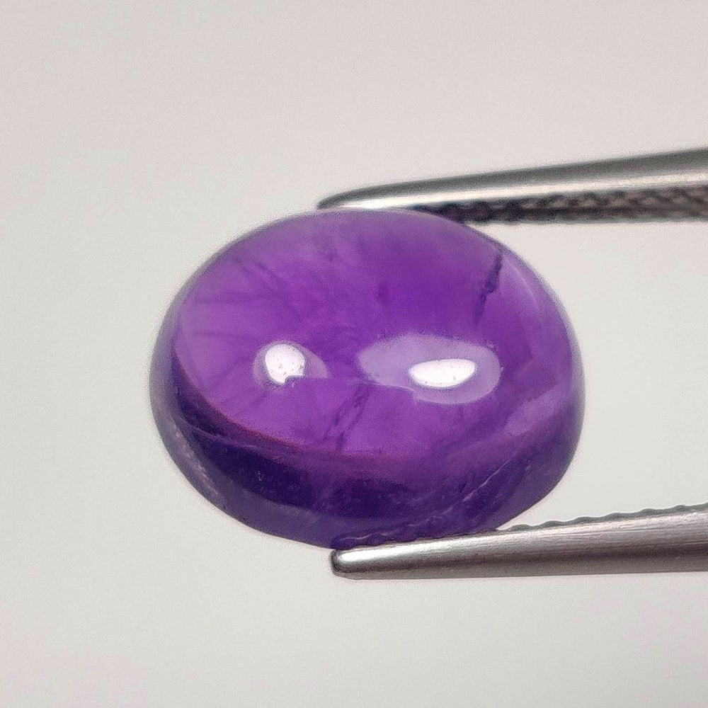 4.80 Ct Natural Purple Amethyst Oval Cab: Weight - 4.80 Ct / Dimensions - 12.00 x 10.00 x 5.10 mm / Shape - Oval Cab / Color - Purple / Clarity - VVS / Origin -Brazil / Treatment - Heated