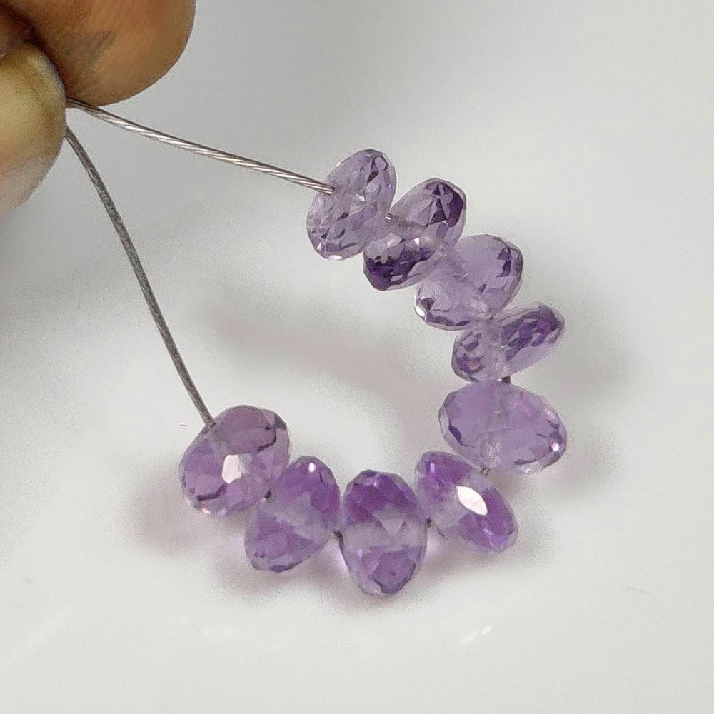 7.45 Ct Natural Purple Amethyst Round Cut Beads: Weight - 7.45 Ct / Dimensions - 5.50 - 6.20 mm / 9 Pc's / Shape - Round Cut Beads / Color - Purple / Clarity - VVS / Origin - Brazil / Treatment - Heated