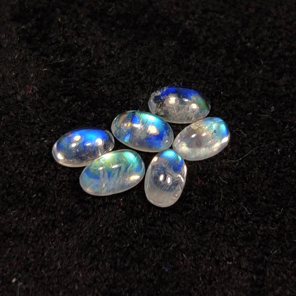 1.61 Ct Natural Blue Tint Moonstone Oval Cab Set: Weight - 1.61 Ct / Size - 5.0x3.0 - 5.4x3.2 mm / 6 pc's / Shape - Oval Cab / Clarity - Semi-Transparent / Origin - India / Treatment - None