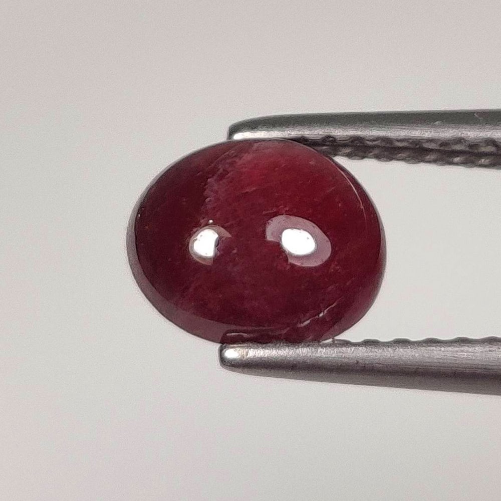 2.17 Ct Natural Red Ruby Oval Cab: Weight - 2.17 Ct / Dimensions - 7.70 x 6.70 x 4.30 mm / Shape - Oval Cab / Color - Red / Clarity - SI / Origin - Mozambique / Treatment - Color Enhanced by Glass Filling