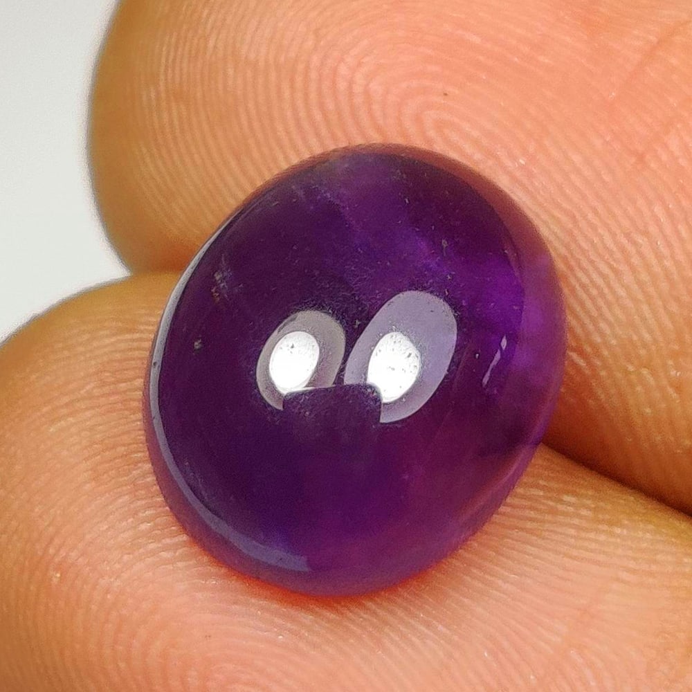 5.72 Ct Natural Purple Amethyst Oval Cab: Weight - 5.72 Ct / Dimensions - 12.20 x 10.20 x 5.80 mm / Shape - Oval Cab / Color - Purple / Clarity - VVS / Origin -Brazil / Treatment - Heated