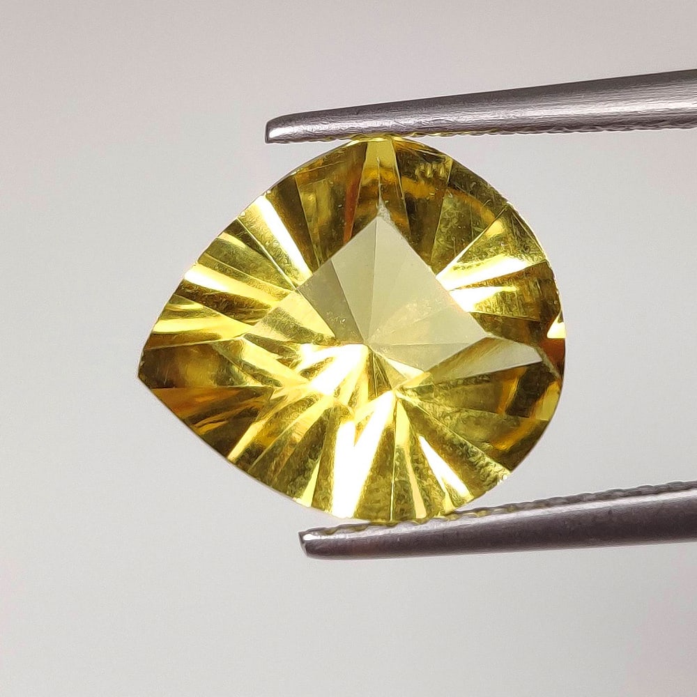 4.12 Ct Natural Yellow Citrine Pear Cut: Weight - 4.12 Ct / Dimensions - 12.10 x 11.00 x 7.00 mm / Shape & Cut - Pear Cut / Color - Yellow / Transparency - VVS / Origin - Brazil / Comments - Heated