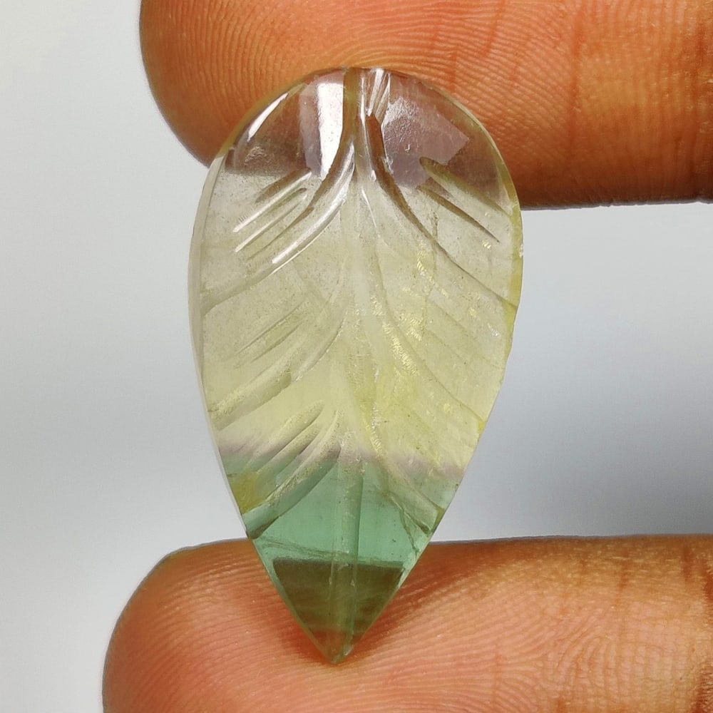 16.78 Ct Natural Multicolor Flourite Pear Carving Cab: Weight - 16.78 Ct / Size - 27.00 x 14.40 x 5.20 mm / Shape - Pear Carving Cab / Color - Multicolor / Clarity - VVS / Origin - Brazil / Treatment - None