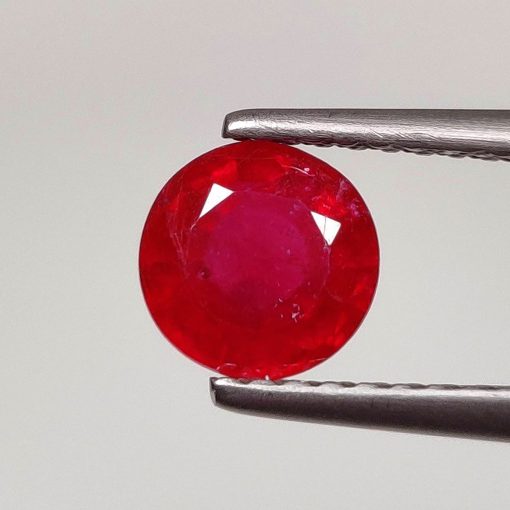 1.20 Ct Natural Pinkish Red Ruby Round Cut: Weight : 1.20 Ct / Dimensions - 6.10 x 6.10 x 3.70 mm / Shape : Round Cut / Color : Pinkish Red / Transparency : Transparent / Treatment : Color Enhanced By Glass Filling