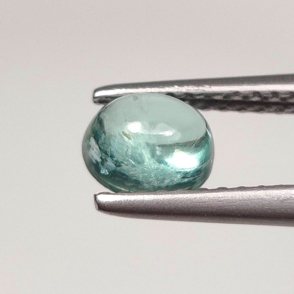 0.84 Ct Natural Neon Blue Apatite Oval Cab: Weight - 0.84 Ct / Dimensions - 6.10 x 5.10 x 3.50 mm / Top Class Quality / Oval Cab / Origin - Brazil / Treatment - None