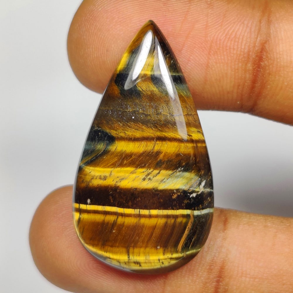 26.80 Ct Natural Tiger Eye Pear Cab (1 of 2)