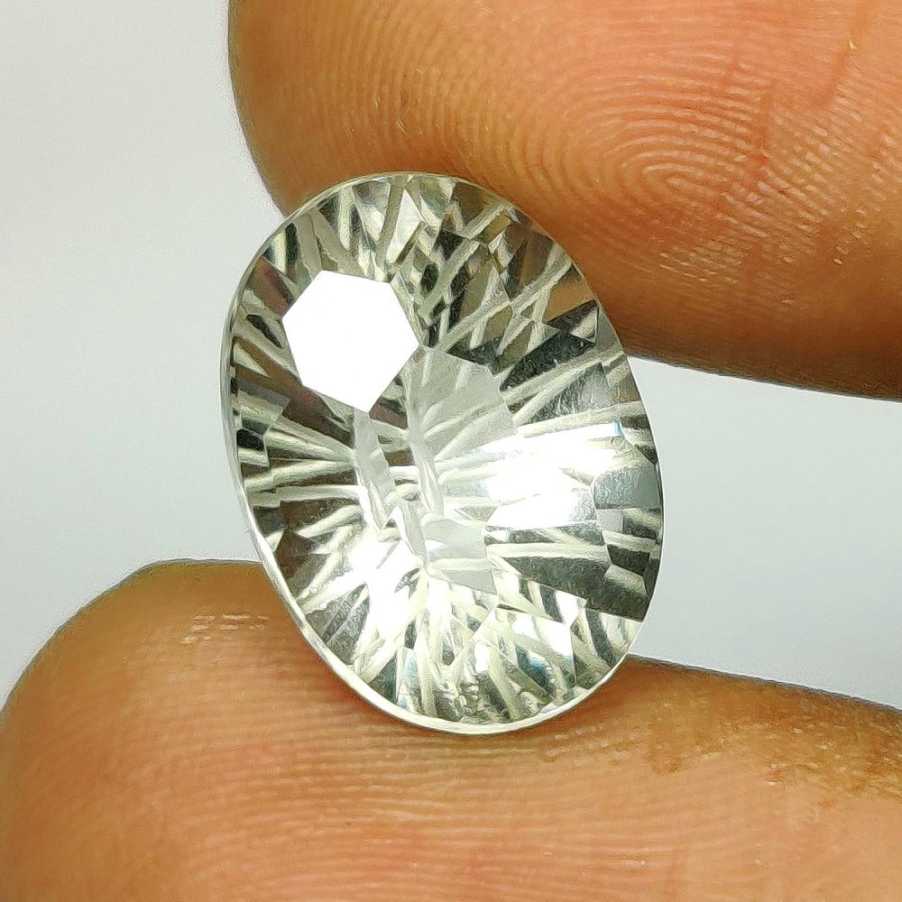 6.57 Ct Natural Green Amethyst Oval Football Cut: Weight - 6.57 Ct / Size - 14.00 x 10.20 x 8.70 mm / Shape - Oval Football Cut / Color - Green / Clarity - VVS / Origin - Brazil / Treatment - Heated