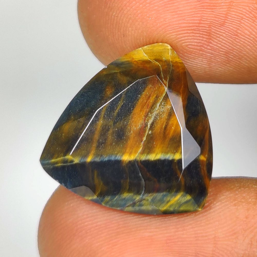 12.44 Ct Natural Tiger Eye Trillion Cut: Weight - 12.44 Ct / Dimensions - 17.30 x 17.20 x 7.50 mm / Top Class Quality / Trillion Cut / Origin - Burmese / Comments - None