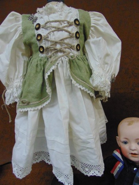 ANTIQUE & VINTAGE GERMAN STYLE DOLL DRESS: ANTIQUE/VINTAGE MAID MARION STYLE DOLL DRESS, MIXED FABRICS, MEASUREMENTS ARE PICTURED.