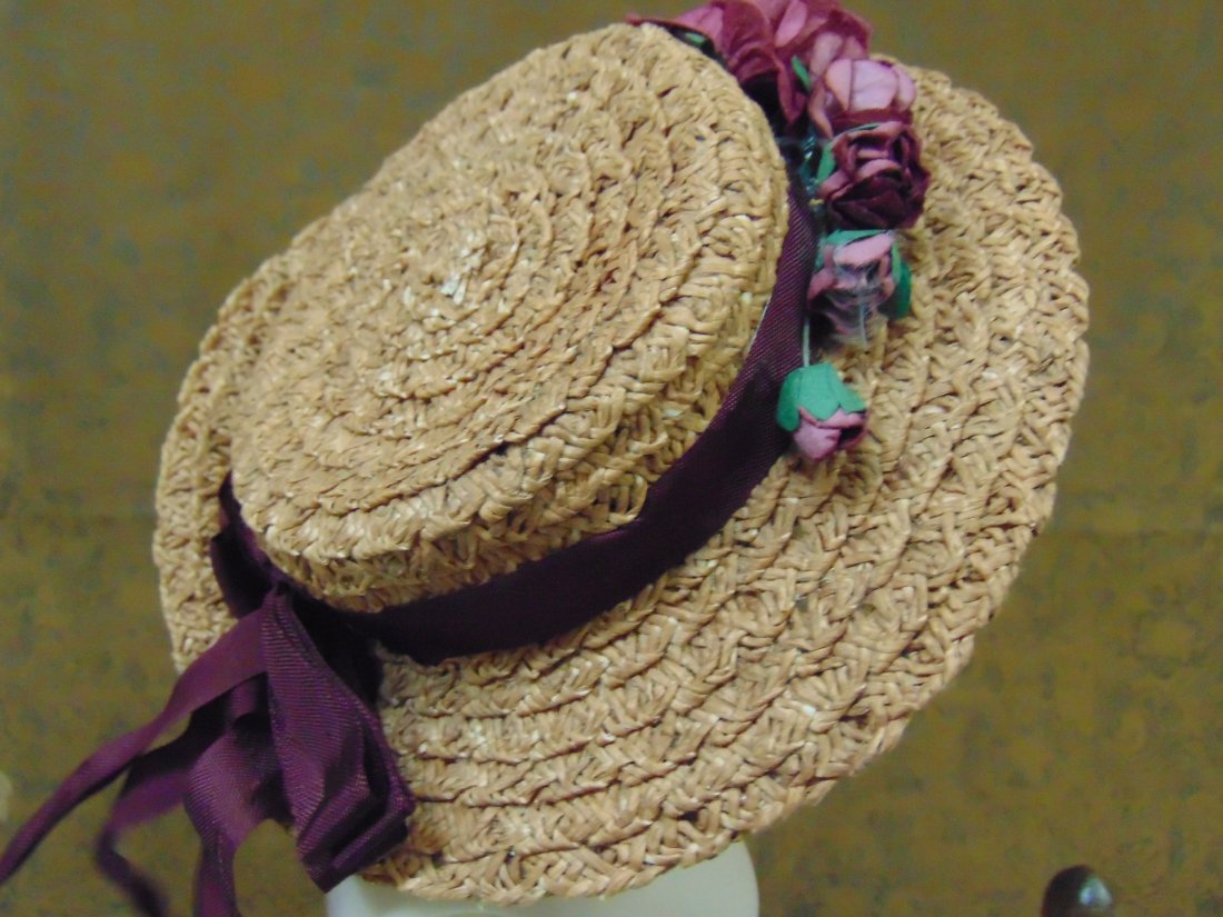 ANTIQUE/VINTAGE DOLL HAT: ANTIQUE/VINTAGE STRAW DOLL HAT W DECORATION. MEASUREMENTS ARE PICTURED. MINOR IMPERFECTIONS.