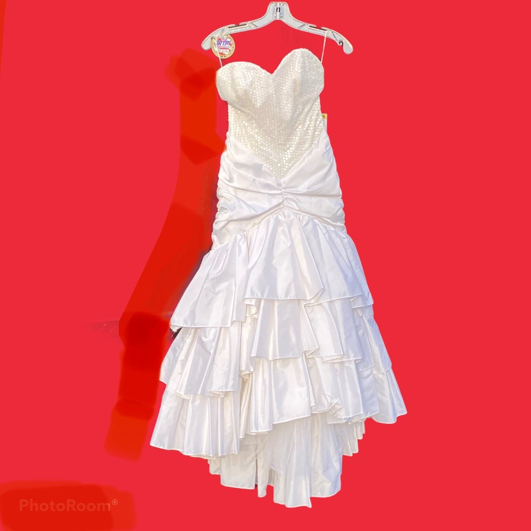 Classic 1980s Prom Dress with Sequins and Fish Tail: Classic 1980s white prom dress with sequins on the bodice and ruffled fish tail. The material is taffeta, Made by What's Up by Carol. Original label attached. Two small stains on one of the tiers on t