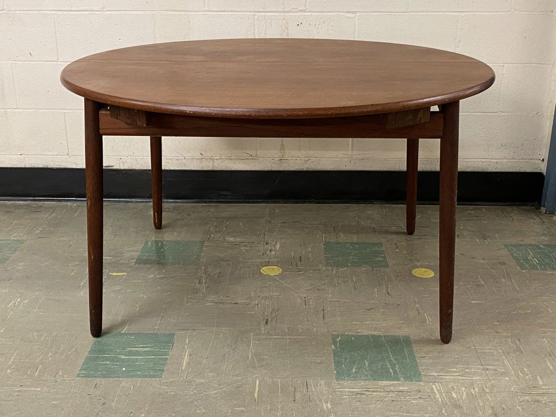 Willy Beck Denmark Dining Room Table with Leaf: Mid century Danish modern dining room table by Willy Beck. Leaf cleverly stores inside the table. Table measurements are 51 inches in diameter without the leaf and 70 inches long with the leaf and 29