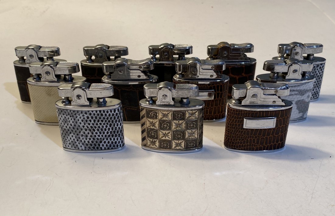 Lot of 12 Penguin Whirling Automatic Lighters: Lot of 12 vintage Penguin Whirling Superlative Automatic Lighters. New old stock.