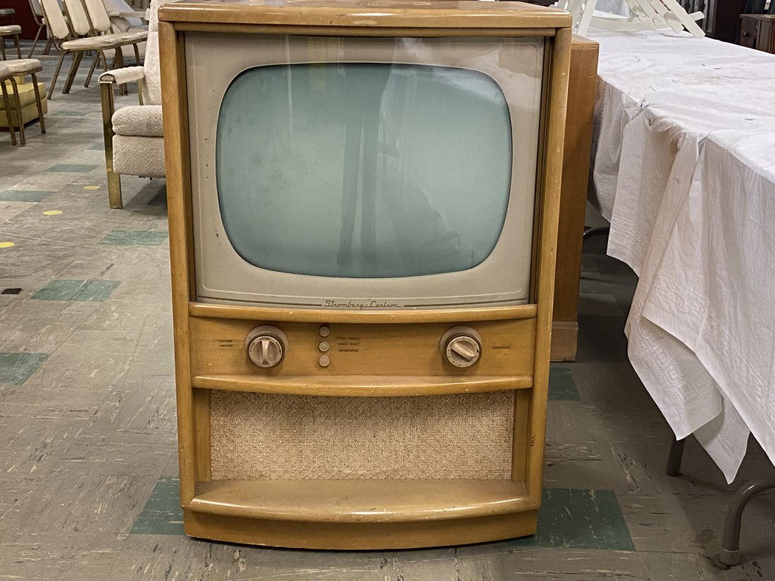 Vintage Stromberg-Carlson Television Cabinet: Vintage Stromberg-Carlson Television Cabinet with Television. It measures 25 inches by 21 inches by 37 inches.