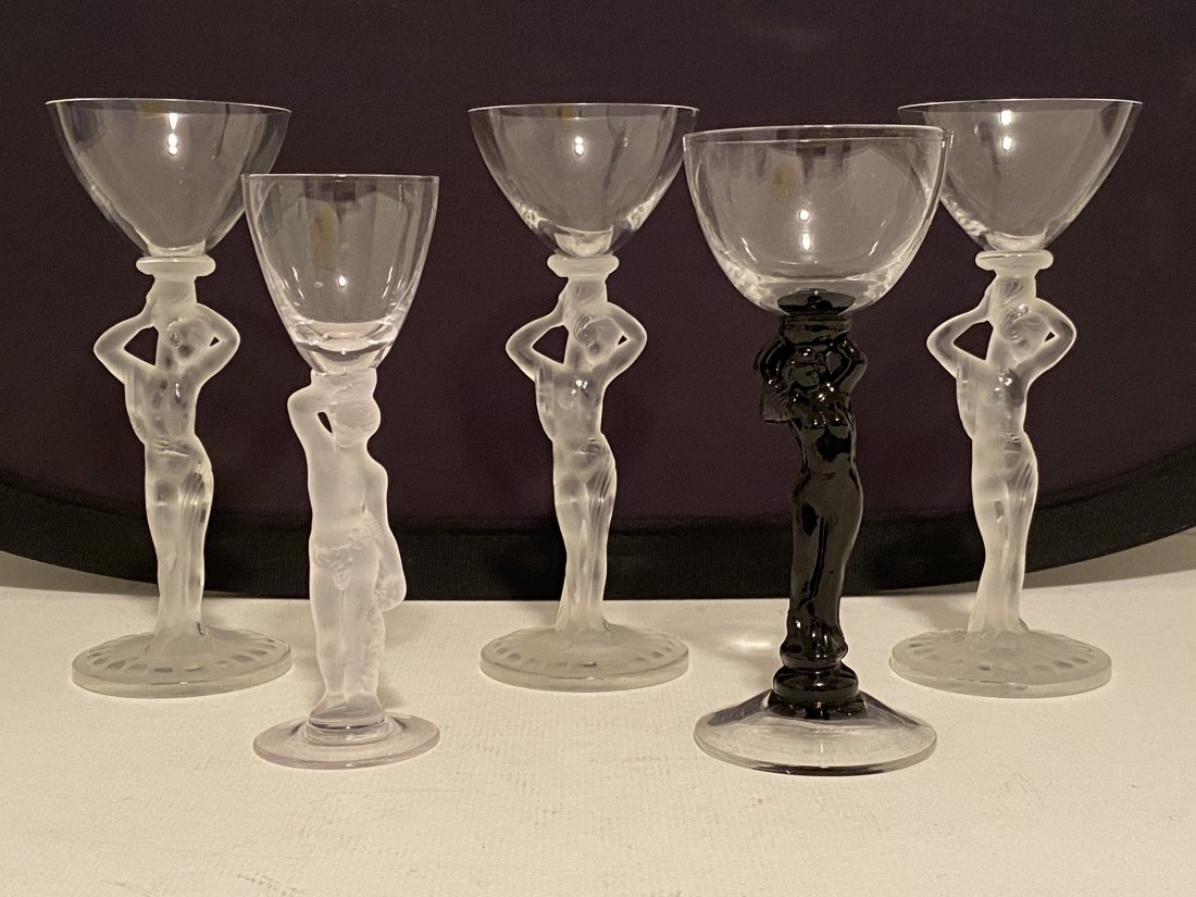 Lot of 5 Figural Wine Glasses: Lot of 5 nude figural wine glasses. 3 Tall glasses are 7 inches by 2.75 inches. The 2 shorter ones are 6.5 inches tall by 2.5 inches in diameter. The smallest is 6 inches tall by 1.75 inches in diamet