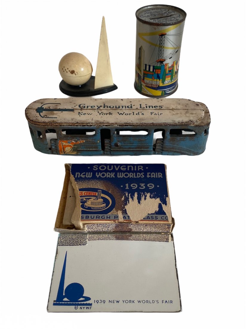 Lot of 1939 NY and 1934 Chicago World’s Fair Souvenirs: Lot of 1939 NY and 1934 Chicago World’s Fair Souvenirs.The lot included an cast iron Greyhound Lines trolley by Arcade Toys from the 1939 NY World’s Fair. It measures 6.5 inches by almost 2 inches