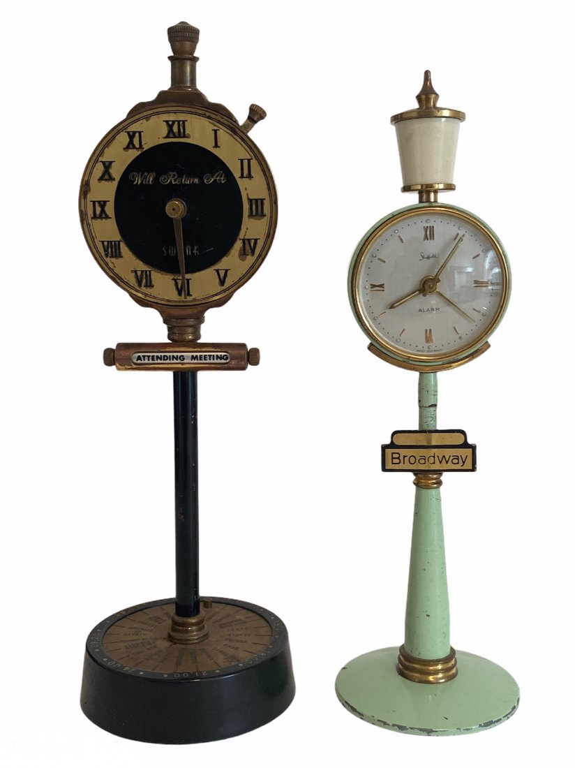 Swank Will Return Table Lighter, Sheffield Alarm Clock: 2 Piece lot that includes a Swank table/desk top Will Return At faux clock with a lighter and revolving marquee and a Sheffield table/desk top alarm clock with the Broadway sign. The Swank lighter mea