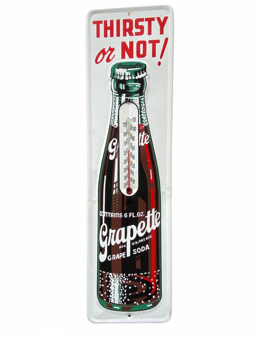 Grapette Grape Soda Advertising Sign Thermometer: Grapette Grape Soda Advertising Sign Thermometer. It measures 16.5 inches by 4.5 inches.